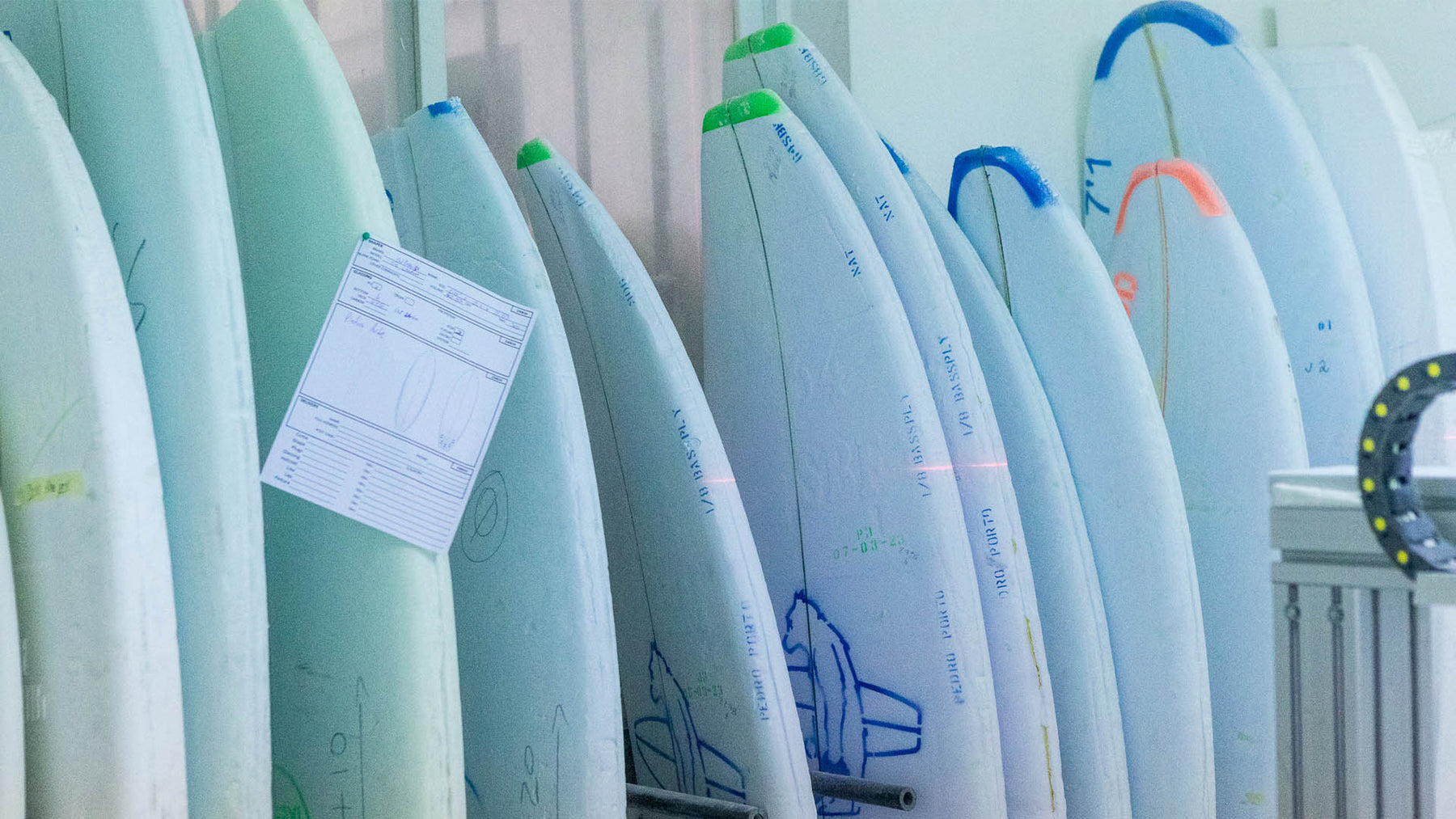 Surfboard blanks with a paper order form. 